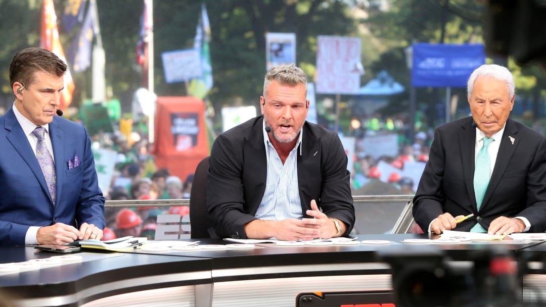 Host Pat McAfee, center, makes a point while Rece Davis, left, and Lee Corso look on during the ESPN College GameDay show on Saturday, Sept. 23, 2023, on the Hesburgh Library lawn on the University of Notre Dame campus in South Bend. The show was to highlight the Notre Dame-Ohio State game.