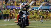 Sep 6, 2014; Eugene, OR, USA; Oregon Ducks mascot rides on the back of a motorcycle for the kick off.