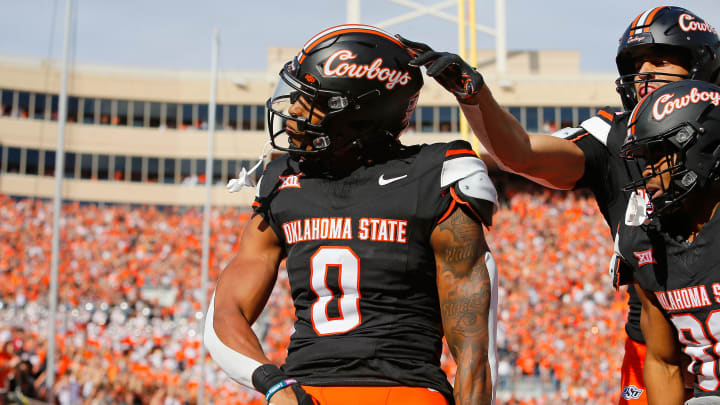 Running back Ollie Gordon II #0 of the Oklahoma State Cowboys celebrates a 20-yard touchdown run against the Oklahoma Sooners in the first quarter of Bedlam at Boone Pickens Stadium on November 4, 2023 in Stillwater, Oklahoma. Oklahoma State won 27-24.