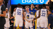Dec 6, 2023; San Francisco, California, USA; Golden State Warriors guard Brandin Podziemski (2) celebrates with forward Jonathan Kuminga (00) after a time out is called against the Portland Trail Blazers during the fourth quarter at Chase Center. Mandatory Credit: Kelley L Cox-USA TODAY Sports