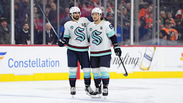 Mar 8, 2025; Philadelphia, Pennsylvania, USA; Seattle Kraken defenseman Brandon Montour (62) reacts with center Matty Beniers (10) after scoring a goal against the Philadelphia Flyers in the third period at Wells Fargo Center. Mandatory Credit: Kyle Ross-Imagn Images