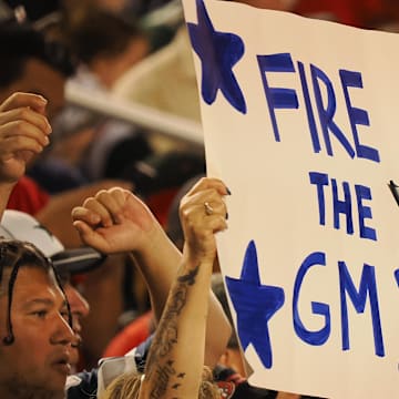 A Dallas Cowboys fan holds a sign reading “fire the GM” during the second quarter against the San Francisco 49ers at Levi's Stadium
