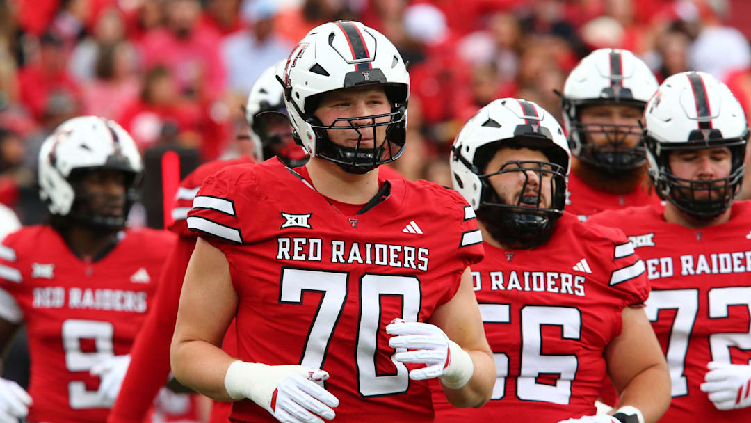 Texas Tech Red Raiders offensive lineman Jacob Ponton (70) runs onto the field in the first half against the Oklahoma State Cowboys at Jones AT&T Stadium.
