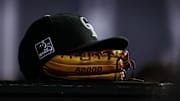 Sep 5, 2018; Denver, CO, USA; A detail view of a Colorado Rockies hat on top of a glove in the seventh inning against the San Francisco Giants at Coors Field.