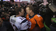 Jan 24, 2016; Denver, CO, USA; New England Patriots quarterback Tom Brady (12) and Denver Broncos quarterback Peyton Manning (18) talk after the AFC Championship football game at Sports Authority Field at Mile High. Mandatory Credit: Chris Humphreys-Imagn Images