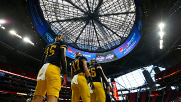 Prince Avenue team captions get ready to take the field for the coin flip before the start of the GHSA high school football Class A-Division 1 championship game against Swainsboro at Mercedes-Benz Stadium in Atlanta, on Monday, Dec. 11, 2023.