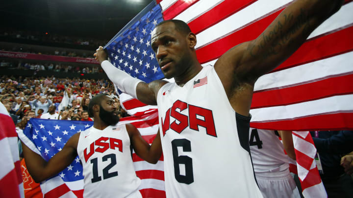 Aug 12, 2012; London, United Kingdom; USA forward LeBron James (6) and guard James Harden (12) celebrate with American flags after defeating Spain 107-100 in the men's basketball gold medal game in the London 2012 Olympic Games at North Greenwich Arena. Mandatory Credit: Rob Schumacher-USA TODAY Sports