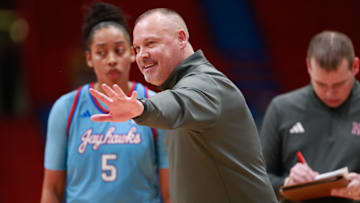 Kansas coach Brandon Schneider talks with players during a timeout in the second half of the game against Iowa State Wednesday, Jan. 24, 2024, inside Allen Fieldhouse