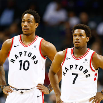 Feb 11, 2018; Charlotte, NC, USA; Toronto Raptors guard Kyle Lowry (7) and guard DeMar DeRozan (10) stands on the court in the first half against the Charlotte Hornets at Spectrum Center. Mandatory Credit: Jeremy Brevard-Imagn Images