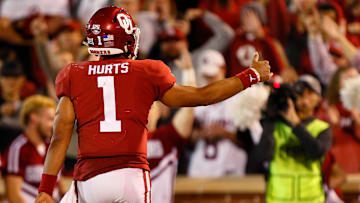 Quarterback Jalen Hurts #1 of the Oklahoma Sooners celebrates his touchdown against the Iowa State Cyclones in the second quarter on November 9, 2019 at Gaylord Family Oklahoma Memorial Stadium in Norman, Oklahoma. OU held on to win 42-41.
