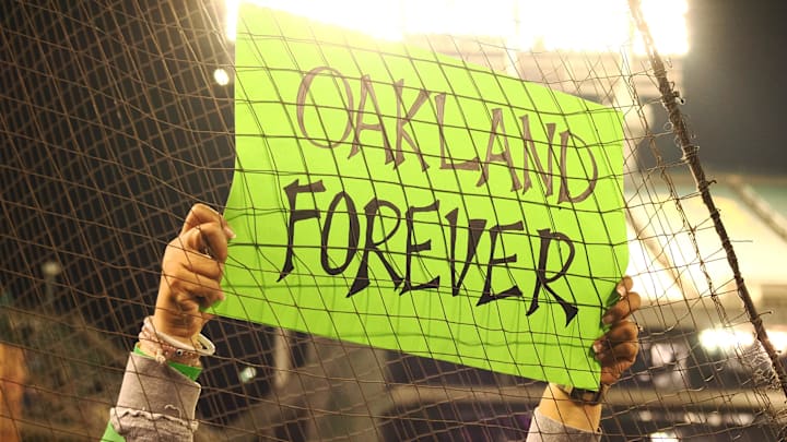 An A’s fan holds up a sign at the final home stand.