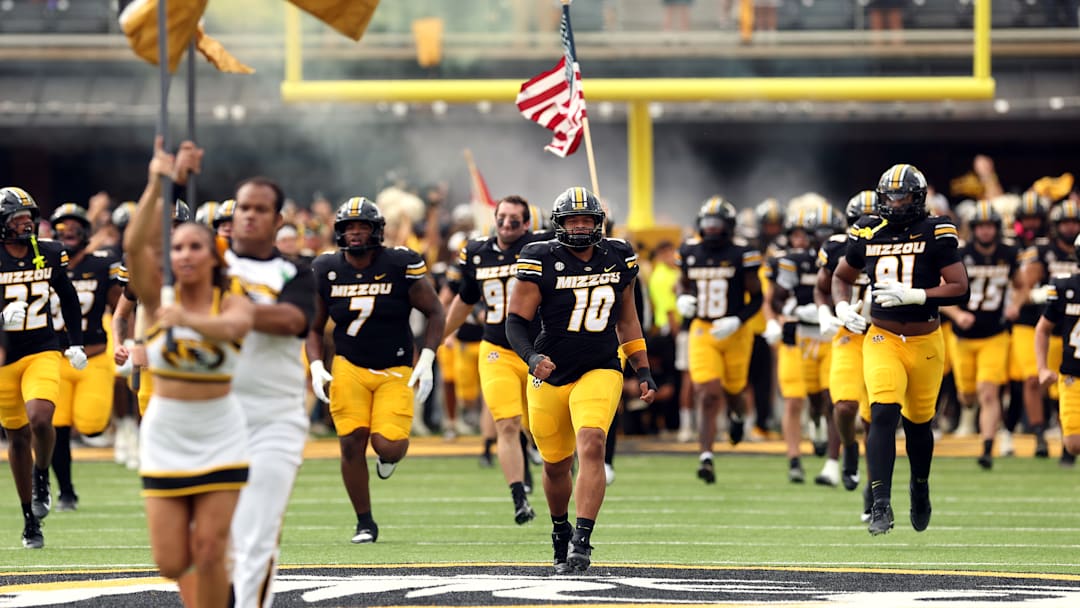 The Missouri Tigers run onto their home field, before a game versus the Alabama Crimson Tide this season.