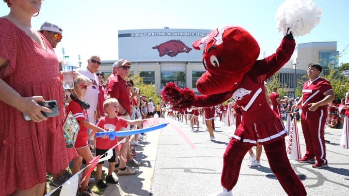 Sep 9, 2023; Fayetteville, Arkansas, USA;  Arkansas Razorbacks mascot entertains fans during the  Hog Walk  prior to the game against the Kent State Golden Flashes at Donald W. Reynolds Razorback Stadium. Mandatory Credit: Nelson Chenault-USA TODAY Sports