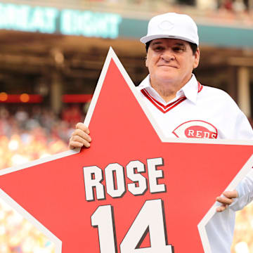 Reds great Pete Rose holds a star bearing his name.