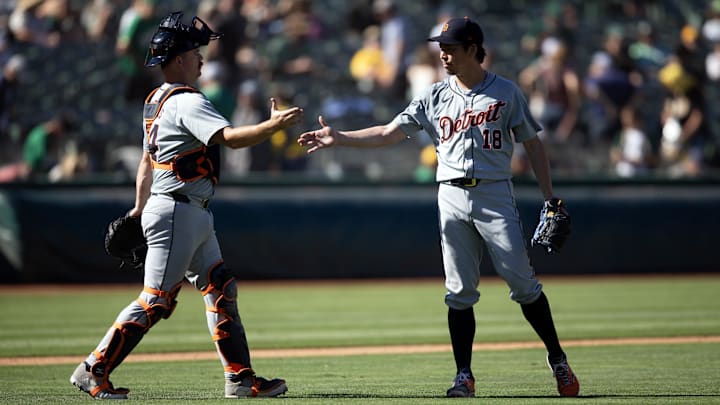 Sep 8, 2024; Oakland, California, USA; Detroit Tigers catcher Jake Rogers (34) and pitcher Kenta Maeda (18) celebrate their 9-1 victory over the Oakland Athletics at Oakland-Alameda County Coliseum. 