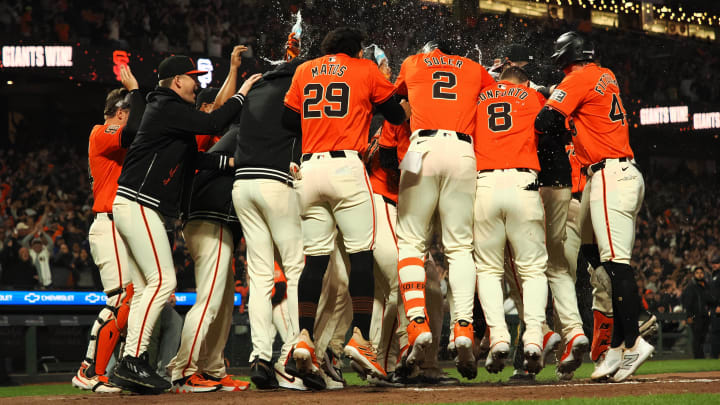 Jun 28, 2024; San Francisco, California, USA; San Francisco Giants players surround second baseman Brett Wisely (0) after Wisely hit a two-run home run for a walk-off win against the Los Angeles Dodgers during the ninth inning at Oracle Park. Mandatory Credit: Kelley L Cox-USA TODAY Sports