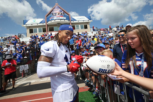 Buffalo Bills wide receiver Chase Claypool signs autographs for fans at the end of day three.