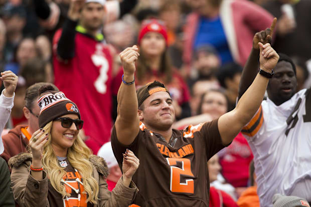 Dec 13, 2015; Cleveland, OH, USA; Cleveland Browns fans show their Johnny Manziel (2) impression during the third quarter aga