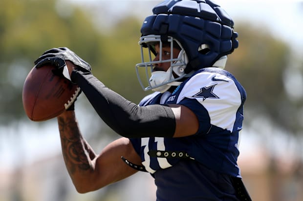 Dallas Cowboys cornerback Josh Butler makes a catch during training camp at the River Ridge Playing Fields in Oxnard.