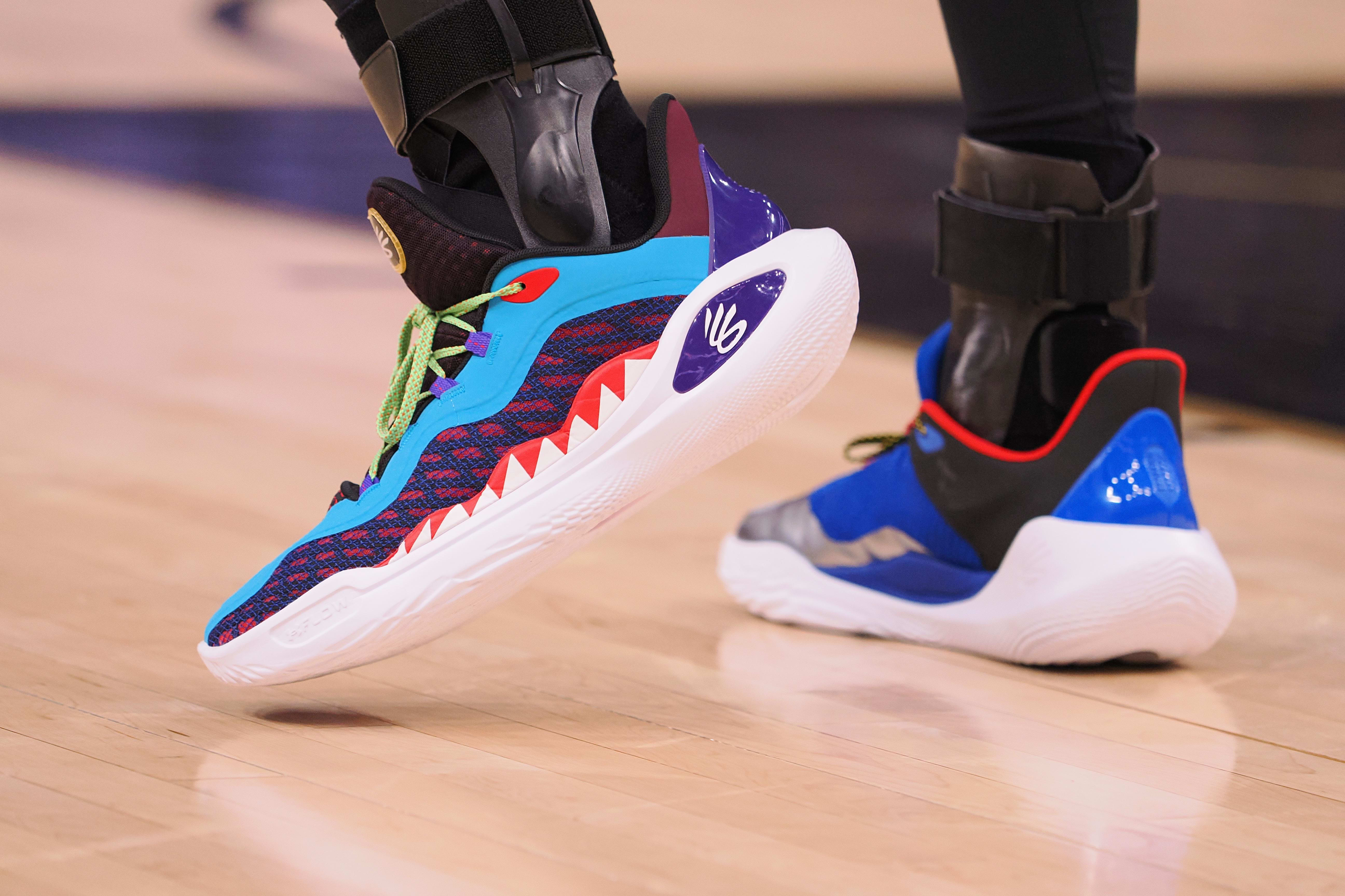 Golden State Warriors guard Stephen Curry's multicolor Under Armour sneakers.
