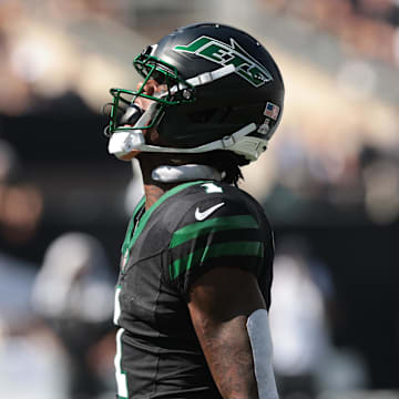 Oct 5, 2025; East Rutherford, New Jersey, USA; New York Jets cornerback Sauce Gardner (1) reacts after making a tackle against the Dallas Cowboys during the first half at MetLife Stadium. Mandatory Credit: Vincent Carchietta-Imagn Images