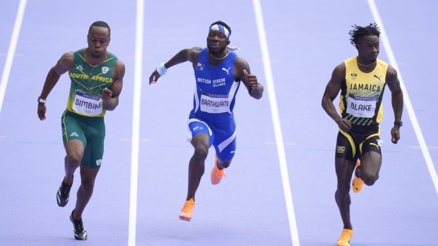 Rikkoi Brathwaite (IVB) races during a men's 100m round 1 heat during the Paris 2024 Olympic Games.