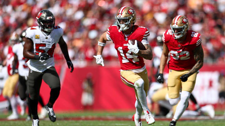 Nov 10, 2024; Tampa, Florida, USA; San Francisco 49ers wide receiver Ricky Pearsall (14) runs with the ball against the Tampa Bay Buccaneers in the first quarter at Raymond James Stadium. Mandatory Credit: Nathan Ray Seebeck-Imagn Images