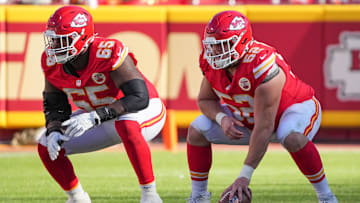 Nov 10, 2024; Kansas City, Missouri, USA; Kansas City Chiefs guard Trey Smith (65) and center Creed Humphrey (52) at the line of scrimmage against the Denver Broncos during the game at GEHA Field at Arrowhead Stadium. Mandatory Credit: Denny Medley-Imagn Images