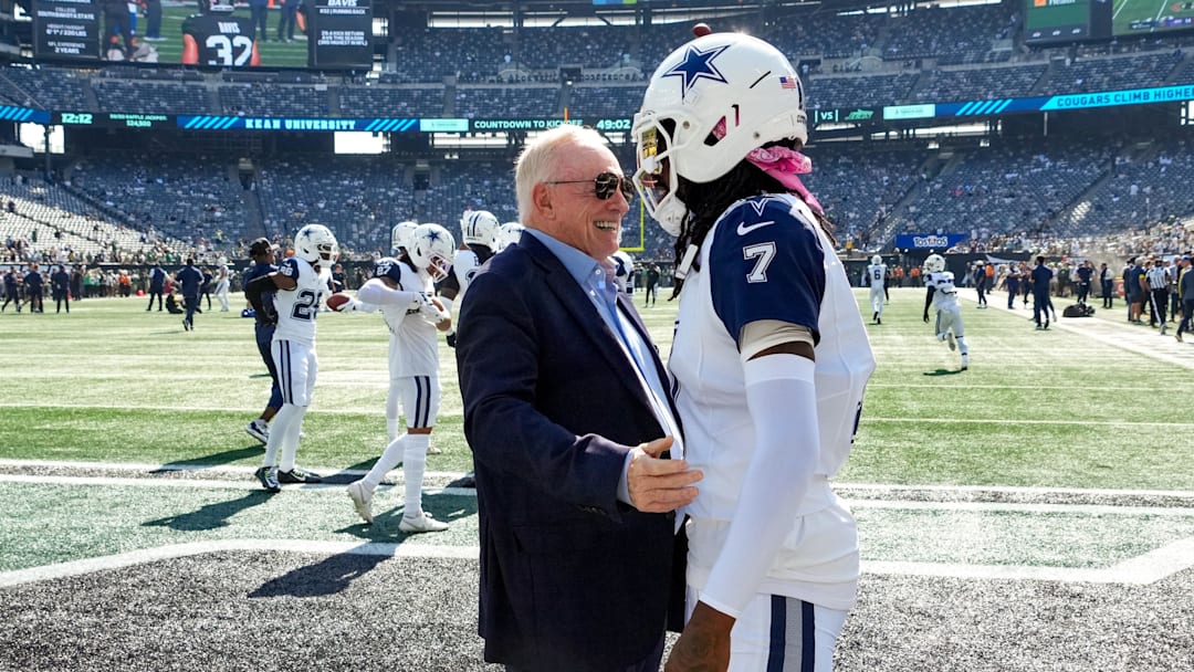 Oct 5, 2025; East Rutherford, New Jersey, USA;  Dallas Cowboys Owner, President and general manager Jerry Jones with cornerback Trevon Diggs (7) on the field prior to a game against the New York Jets  at MetLife Stadium. Mandatory Credit: Robert Deutsch-Imagn Images