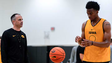 Iowa men’s basketball head coach Ben McCollum talks to Tavion Banks (6) as he prepares to shoot a free throw during practice June 19, 2025 at Carver-Hawkeye Arena in Iowa City, Iowa.