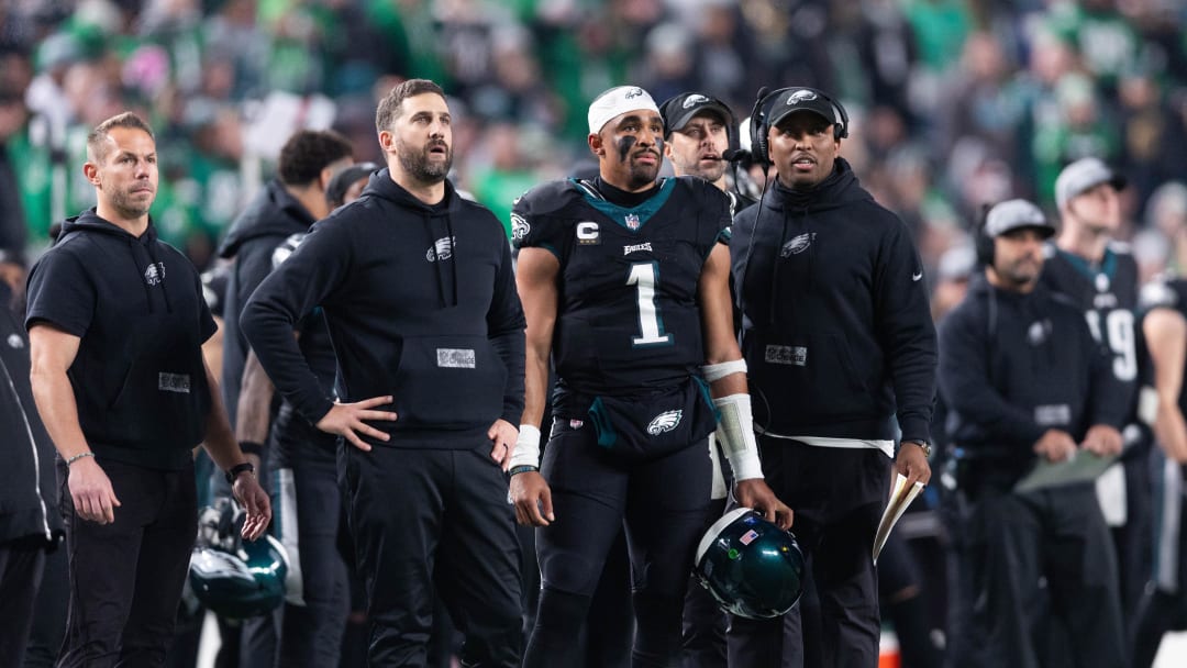 Dec 25, 2023; Philadelphia, Pennsylvania, USA; Philadelphia Eagles head coach Nick Sirianni (L) and quarterback Jalen Hurts (1) and offensive coordinator Brian Johnson (R) look on during the second quarter against the New York Giants at Lincoln Financial Field. Mandatory Credit: Bill Streicher-USA TODAY Sports