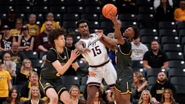 Missouri guard Anthony Robinson II tries to steal a pass from Texas A&M.