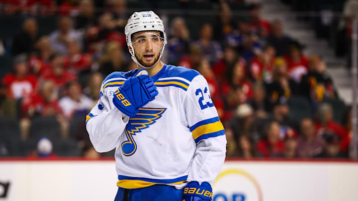 Mar 18, 2026; Calgary, Alberta, CAN; St. Louis Blues defenseman Logan Mailloux (23) against the Calgary Flames during the third period at Scotiabank Saddledome. Mandatory Credit: Sergei Belski-Imagn Images