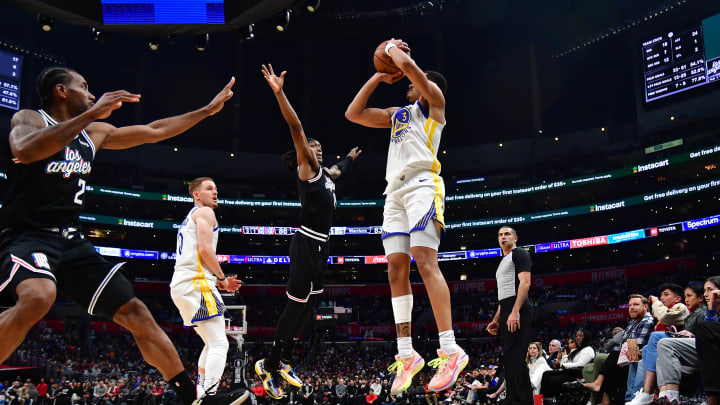 Feb 14, 2023; Los Angeles, California, USA; Golden State Warriors guard Jordan Poole (3) shoots a three point basket against Los Angeles Clippers forward Kawhi Leonard (2) during the second half at Crypto.com Arena.