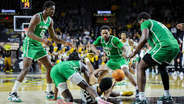 Wichita State Shockers guard Harlond Beverly (20) and North Texas Mean Green guard Rondel Walker (5)