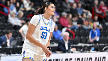 Mar 30, 2025; Spokane, WA, USA; UCLA Bruins center Lauren Betts (51) stretches before a the Elite 8 NCAA Tournament basketball game against the LSU Lady Tigers at Spokane Arena.