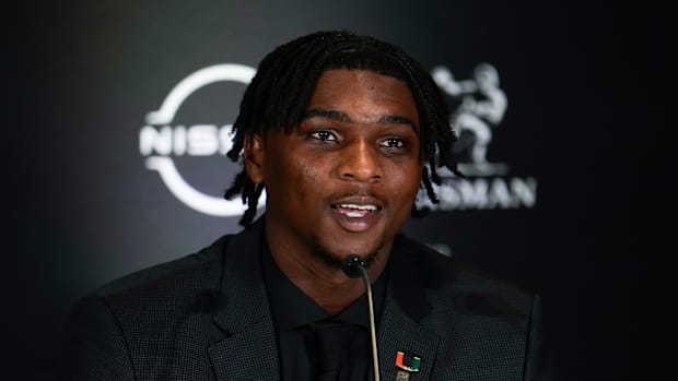Miami Hurricanes quarterback Cam Ward speaks on stage during a press conference before the 2024 Heisman Trophy Presentation
