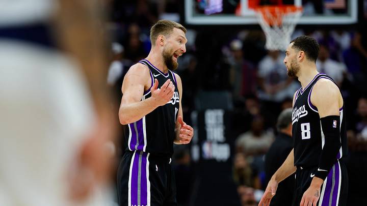 Apr 16, 2025; Sacramento, California, USA; Sacramento Kings forward Domantas Sabonis (11) talks with guard Zach LaVine (8) during the second quarter against the Dallas Mavericks at Golden 1 Center. Mandatory Credit: Sergio Estrada-Imagn Images