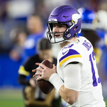 Jan 13, 2025; Glendale, AZ, USA; Minnesota Vikings quarterback Daniel Jones (13) against the Los Angeles Rams during an NFC wild card game at State Farm Stadium. Mandatory Credit: Mark J. Rebilas-Imagn Images