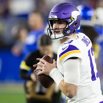 Jan 13, 2025; Glendale, AZ, USA; Minnesota Vikings quarterback Daniel Jones (13) against the Los Angeles Rams during an NFC wild card game at State Farm Stadium. Mandatory Credit: Mark J. Rebilas-Imagn Images