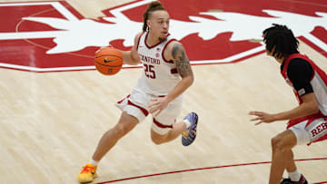 Dec 7, 2025; Stanford, California, USA;  Stanford Cardinal guard Jeremy Dent-Smith (25) dribbles against UNLV Runnin' Rebels forward Tyrin Jones (6) in the second half at Maples Pavilion. Mandatory Credit: David Gonzales-Imagn Images