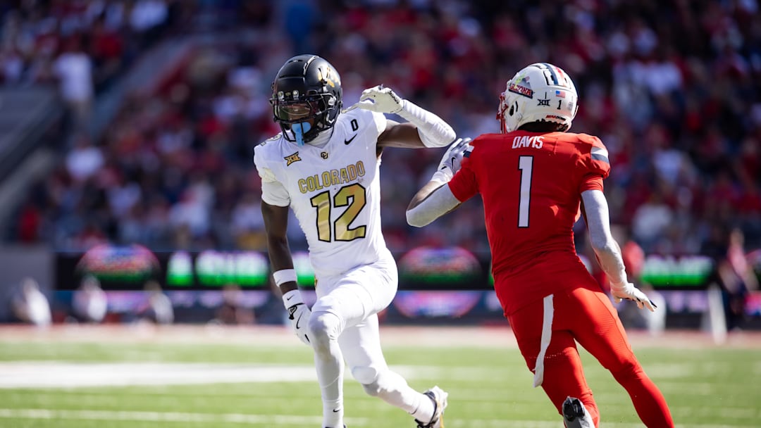 Oct 19, 2024; Tucson, Arizona, USA; Colorado Buffalos wide receiver Travis Hunter (12) against Arizona Wildcats cornerback Tacario Davis (1) at Arizona Stadium.