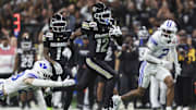Dec 28, 2024; San Antonio, TX, USA; Colorado Buffaloes wide receiver Travis Hunter (12) runs with the ball during the second quarter against the Brigham Young Cougars at Alamodome. Mandatory Credit: Troy Taormina-Imagn Images