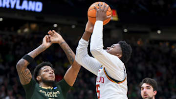 Mar 23, 2025; Seattle, WA, USA; Maryland Terrapins center Derik Queen (25) drives to the basket against Colorado State Rams forward Jaylen Crocker-Johnson (8) in the first half at Climate Pledge Arena. Mandatory Credit: Steven Bisig-Imagn Images