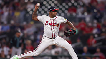 Jun 4, 2025; Atlanta, Georgia, USA; Atlanta Braves relief pitcher Raisel Iglesias (26) throws against the Arizona Diamondbacks in the eighth inning at Truist Park. Mandatory Credit: Brett Davis-Imagn Images
