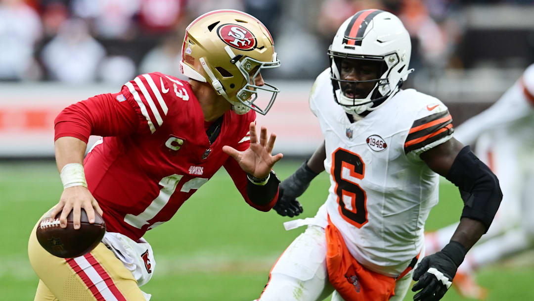 Oct 15, 2023; Cleveland, Ohio, USA; San Francisco 49ers quarterback Brock Purdy (13) scrambles from Cleveland Browns linebacker Jeremiah Owusu-Koramoah (6) during the second half at Cleveland Browns Stadium. Mandatory Credit: Ken Blaze-Imagn Images
