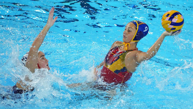 Spain left wing Judith Forca Ariza (9) throws the ball against United States driver Jenna Michelle Flynn