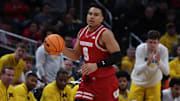 Mar 16, 2025; Indianapolis, IN, USA; Wisconsin Badgers guard John Tonje (9) dribbles downcourt during the second half against the Michigan Wolverines during the 2025 Big Ten Championship Game at Gainbridge Fieldhouse.