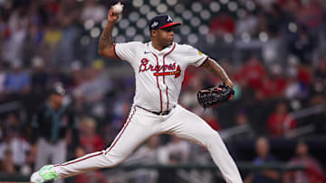 Jun 4, 2025; Atlanta, Georgia, USA; Atlanta Braves relief pitcher Raisel Iglesias (26) throws against the Arizona Diamondbacks in the eighth inning at Truist Park. Mandatory Credit: Brett Davis-Imagn Images
