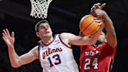 Feb 5, 2025; Piscataway, New Jersey, USA; Illinois Fighting Illini center Tomislav Ivisic (13) rebounds against Rutgers Scarlet Knights center Lathan Sommerville (24) during the first half at Jersey Mike's Arena. Mandatory Credit: Vincent Carchietta-Imagn Images